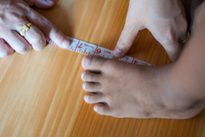 Measuring foot of a tall person