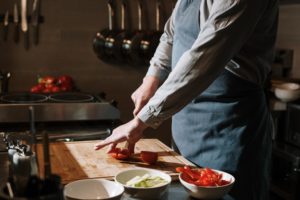 Gender non-conforming - man cooking